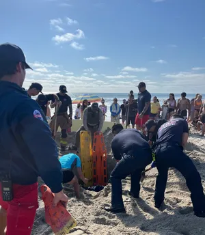 Teen Girl rescued after getting trapped in sand hole at San Diego beach