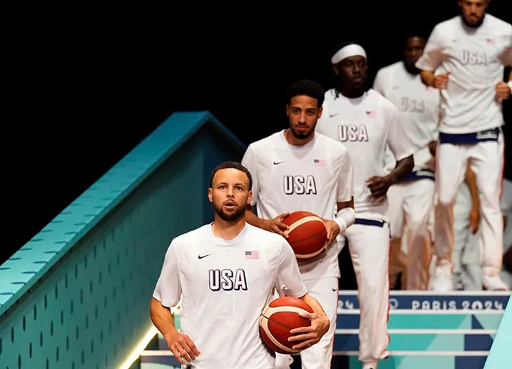 United States shooting guard Stephen Curry (4) warms up before a game against Serbia during the Paris 2024 Olympic Summer Games at Stade Pierre-Mauroy.