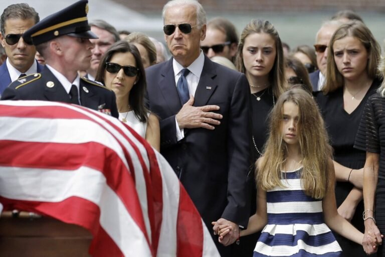 June 6, 2015 | Vice President Joe Biden, accompanied by his family, holds his hand over his heart during the funeral of his son, former Delaware Attorney General Beau Biden in Wilmington, Delaware. Standing alongside the vice president are Beau's widow Hallie Biden, left, and daughter, Natalie. Beau Biden died of brain cancer at age 46.