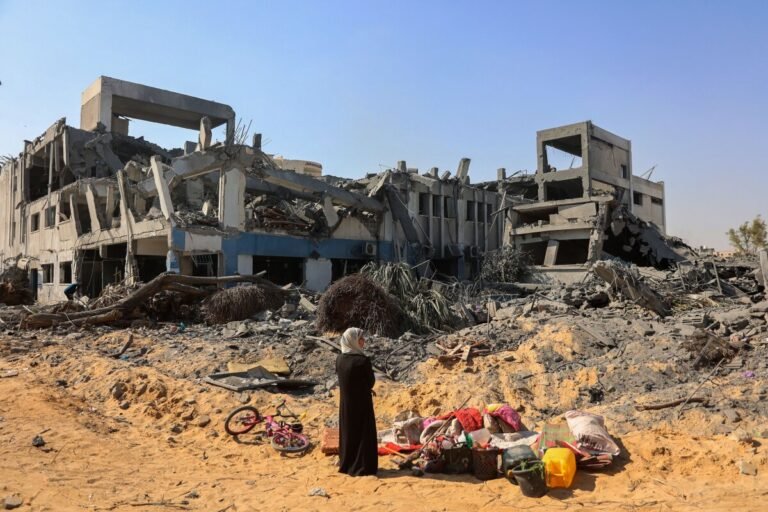 July 12, 2024 | A woman looks for salvageable items at the damaged U.N. Relief and Works Agency for Palestine Refugees building complex in the al-Sinaa neighborhood of Gaza City, Gaza.