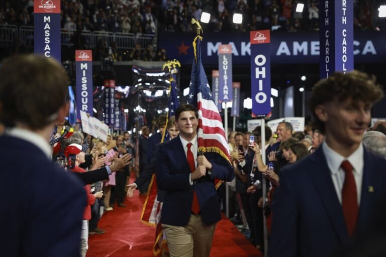 University of North Carolina fraternity members carry the American flag on the third day of the Republican National Convention.