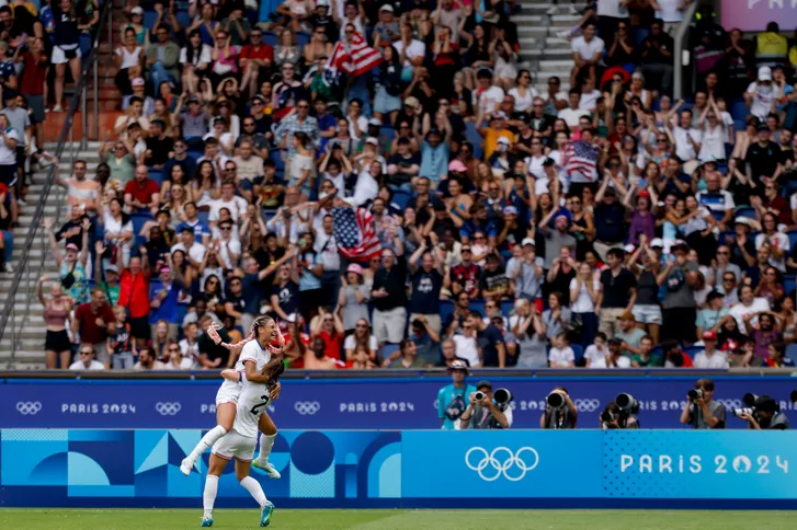 United States forward Trinity Rodman (5) and United States defender Emily Fox (2) celebrate after Rodman scored a game-winning goal during the quarterfinals during the Paris 2024 Olympic Summer Games at Parc des Princes. Rodman broke a scoreless tie in the second and final minute of stoppage time during the first half of extra time Saturday against Japan at the 2024 Paris Olympics. Her goal sent the U.S. through to the semifinals with a 1-0 victory.