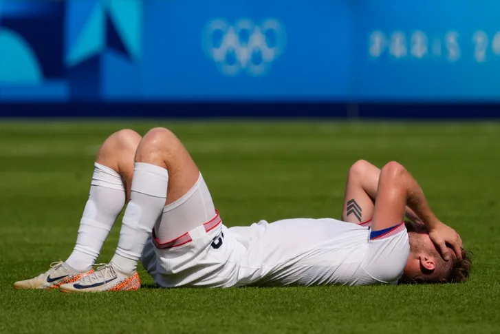 United States forward Duncan McGuire (13) reacts after losing to Morocco in a men's football quarterfinal during the Paris 2024 Olympic Summer Games at Parc des Princes on Aug. 2, 2024. Andrew P. Scott, USA TODAY Sports