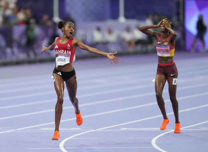 Winfred Yavi (BRN) defeats Peruth Chemutai (UGA) to win the women's 3000m steeplechase final during the Paris 2024 Olympic Summer Games at Stade de France on Aug. 6, 2024.