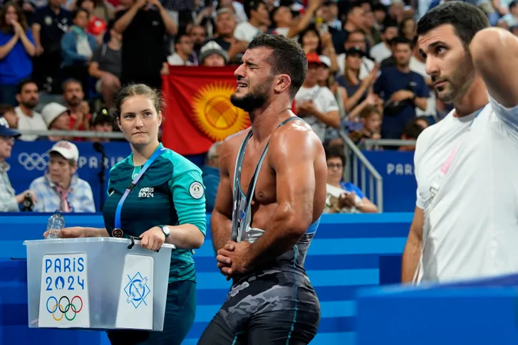 Sanan Suleymanov (AZE) reacts after losing to Akzhol Makhmudov (KGZ) in a men’s greco-roman 77kg bronze medal match during the Paris 2024 Olympic Summer Games at Champ-de-Mars Arena on Aug. 7, 2024.