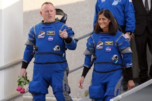 NASA astronauts Suni Williams and Butch Wilmore stand together for a photo en route to the launch pad at Space Launch Complex 41 June 5, 2024, in Cape Canaveral, Fla.