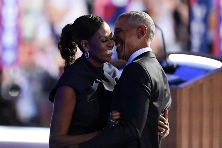 Aug. 20, 2024 | Chicago | Former President Barack Obama hugs former first lady Michelle Obama on the second day of the Democratic National Convention.