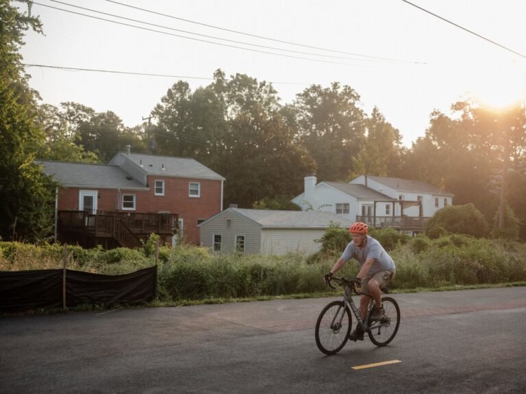 Aug. 1, 2024 | A cyclist rides along the Washington and Old Dominion Trail. Falls Church contains multiple access points to the trail, which runs 45 miles between the Shirlington area of Arlington County, Virginia, and the town of Purcellville.