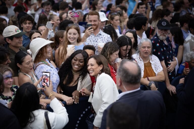 July 4, 2024 | Vice President Kamala Harris takes selfies with audience members during an Independence Day celebration at the White House in Washington, D.C.