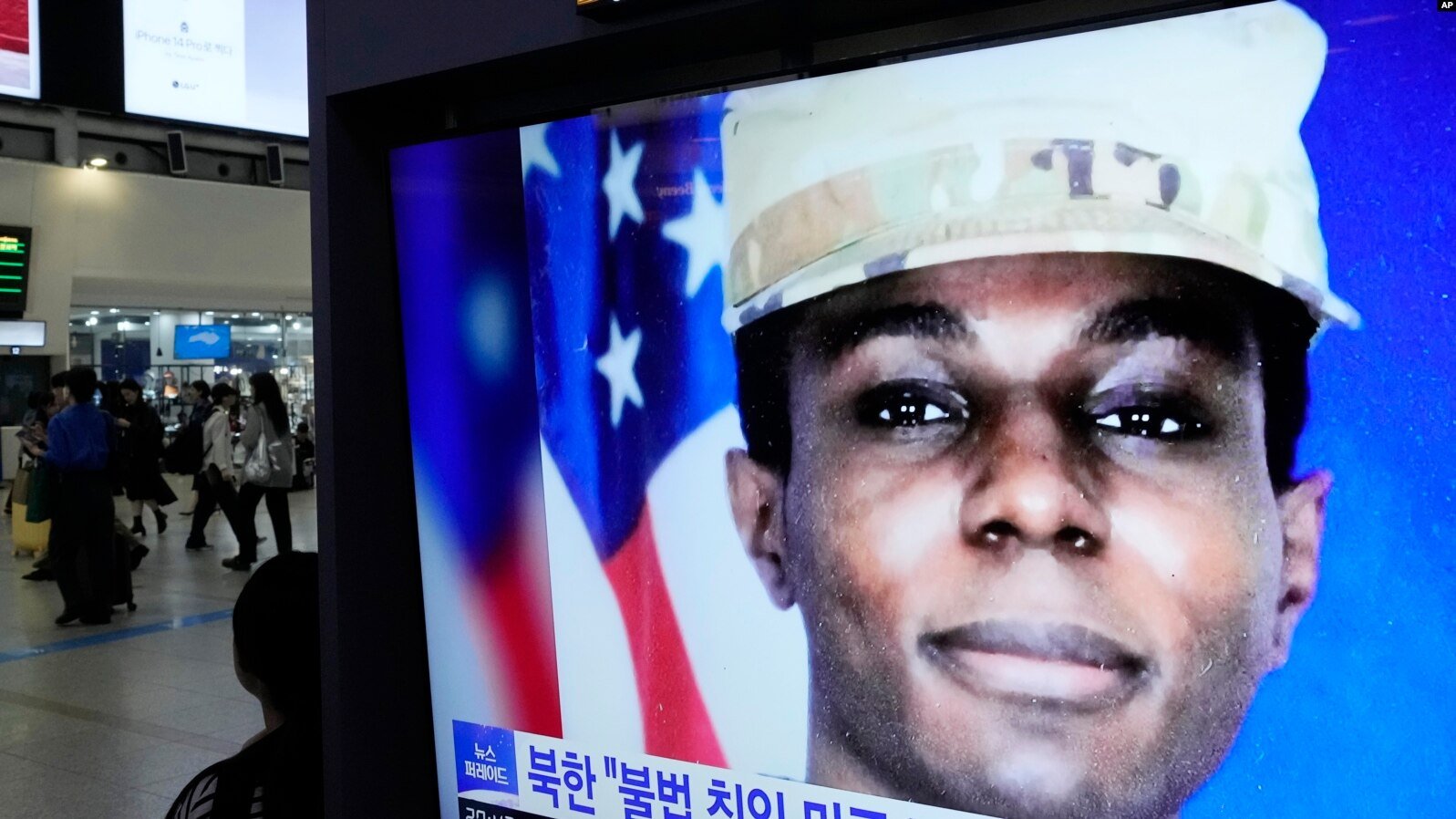 A TV screen shows a file image of American soldier Travis King during a news program at the Seoul Railway Station in Seoul, South Korea, Sept. 27, 2023.